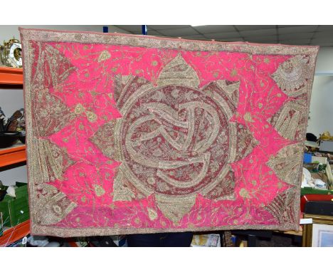 AN ASIAN EMBROIDERED WALL HANGING, embroidered in gold and silver threads over different shades of pink and red, backed and m