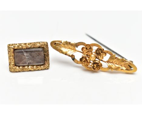 A YELLOW METAL VICTORIAN BROOCH AND A MEMORIAL BROOCH, the first of an openwork floral design, stamped to the reverse 15c, fi