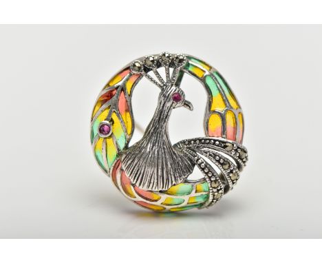 A WHITE METAL PLIQUE A JOUR PEACOCK BROOCH/PENDANT, of a circular openwork design displaying a peacock head, marcasite detail