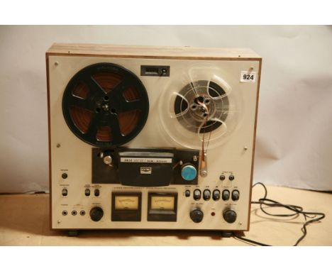 AN AKAI GX-230D REEL TO REEL RECORDER with two boxes of tape reels, ( untested due to no plug)