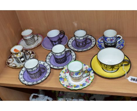 AN EARLY 20TH CENTURY AYNSLEY YELLOW TEA CUP AND SAUCER WITH WHITE METAL OVERLAY AND SEVEN AYNSLEY COFFEE CANS IN HALLMARKED 