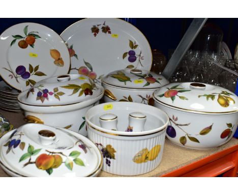 A ROYAL WORCESTER 'EVESHAM' PATTERN PART DINNER SERVICE, comprising two circular deep casserole dishes and covers, an oval ca