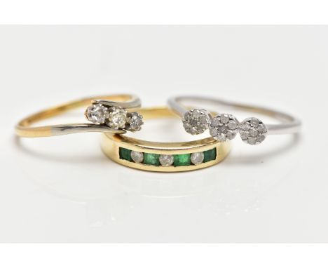 THREE GEM SET RINGS, the first a yellow metal half eternity ring set with four square cut emeralds and three round brilliant 