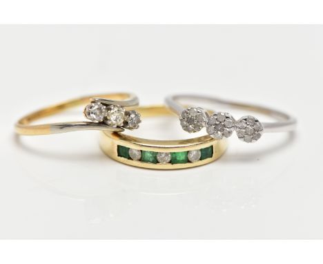 THREE GEM SET RINGS, the first a yellow metal half eternity ring set with four square cut emeralds and three round brilliant 