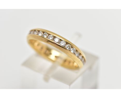 AN 18CT GOLD, FULL DIAMOND ETERNITY BAND, designed with a row of channel set, round brilliant cut diamonds, estimated total d