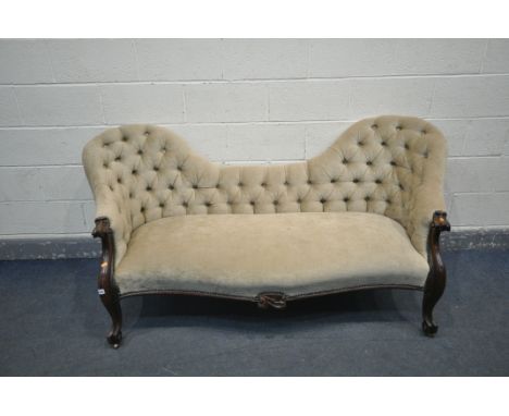 A VICTORIAN SOFA, with two raised ends, button back, scrolled terminations, on cabriole front legs, and brass casters, seat w