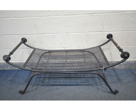 A WROUGHT IRON CURVED BENCH, with strapwork seat, length 123cm x depth 50cm x height 62cm (condition - coloring worn off the 