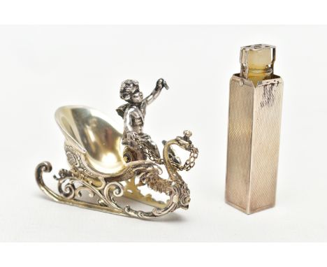 A SILVER TRAVEL PERFUME CASE AND A WHITE METAL FIGURINE, engine turned pattern to the rectangular perfume bottle case, hallma