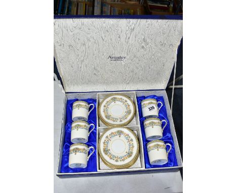 A BOXED SET OF AYNSLEY 'HENLEY' PATTERN COFFEE CANS, comprising six saucers with six coffee cans in a blue satin lined presen