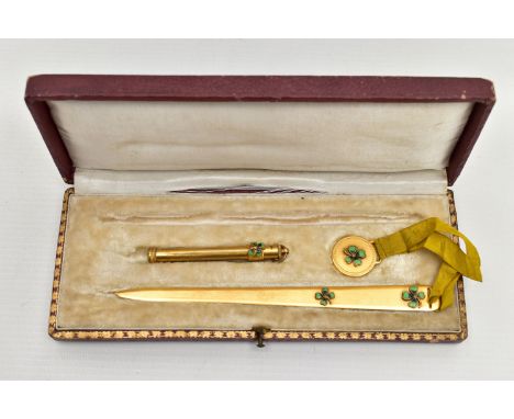 A CASED EARLY 20TH CENTUY GILT METAL AND ENAMELLED FOUR LEAF CLOVER DESIGN DESK/ WRITING SET, the fitted case containing a le