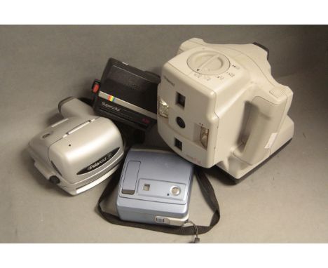 A Polaroid Macro 5 SLR Camera,  together with 3 other Polaroid Cameras