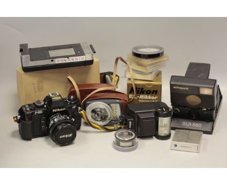 Nikon F501 Camera, with an MF 19 Data back, a Polaroid 680, a Leica Pradovit projector, and other items (a lot, 2 parts)