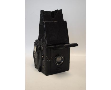 A Houghtons Ensign Popular Reflex Quarter-Plate Camera, Ross  Zeiss Tessar f4.5 150mm lens, in original leather case with spa