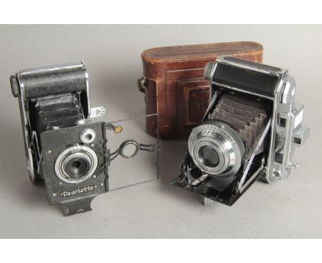 Konica Pearlette Camera, folding 127 camera, with a Petri Semi (the first camera to use the Petri name)