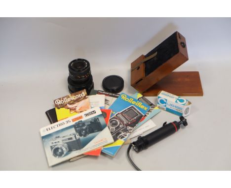 A Mahogany split view measuring device,  together with some 35mm camera accessories and a qty of original instruction manuals