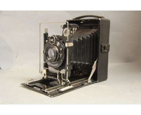 German Folding Plate Camera,  Xenar F4.5 135mm lens, together with spare backs and leather case.