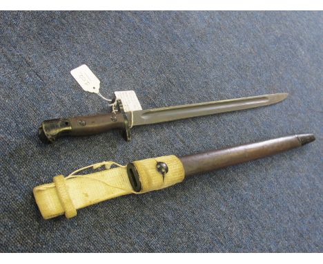 Bayonet: P07 bayonet by MA (Australian manufactured at Lithgow) in January 1942. In its steel mounted leather scabbard (metal