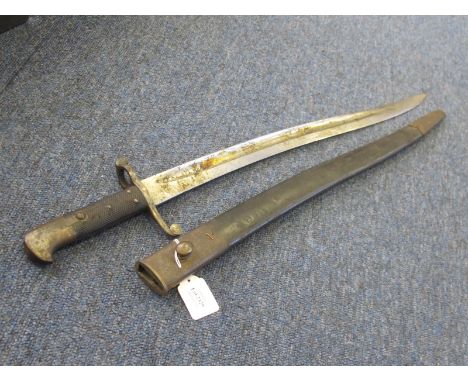 Bayonet: A British Pattern 1856/8 Volunteer sword bayonet, pommel marked 'V-GM A3-402' to a Volunteer Artillery unit. Good bl