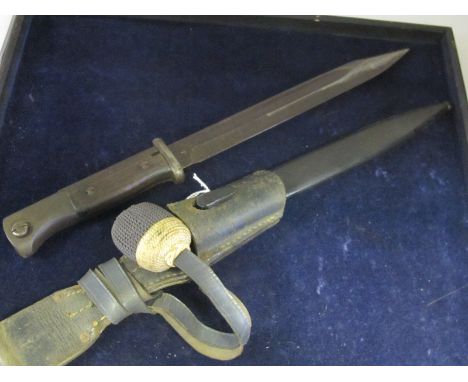 Bayonet: German 3rd Reich Model 1884/98 knife bayonet in its steel scabbard with leather frog and troddel. Wood grips. Ricass