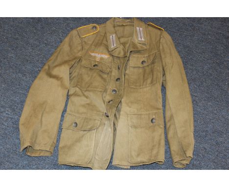 German Uniform - Composite German army jacket with original buttons and replacement insignia. Inside stamp and pen markings. 