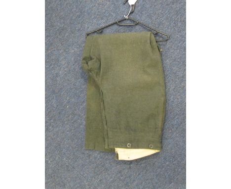 German Uniform - Standard German army issue trousers with metal buttons in service green finish. Minor holes and surface wear