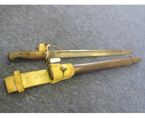 Bayonet: German Model 1898 NCOS bayonet 1st pattern with one piece wrap around grips in its steel mounted leather scabbard. B