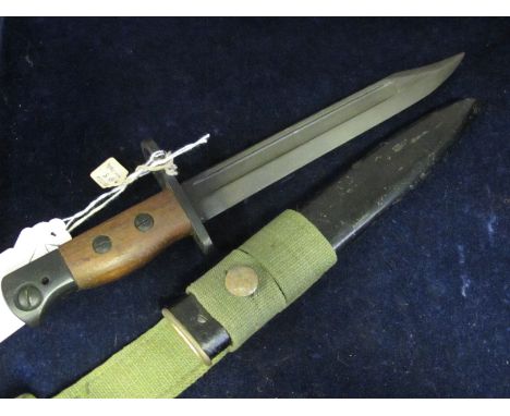 Bayonet: No 5 MK1 bayonet in its metal scabbard with web frog. Wood grips. In very good condition. 