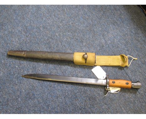 Bayonet: India Pattern MKII SMLE short bayonet dated 10.42 by R.F.I. Blued unfullered blade. In its steel mounted leather sca