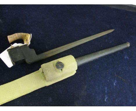 Bayonet: A No4 MKI Spike with CRUCIFORM blade, in its steel scabbard with web frog. In good condition overall. 