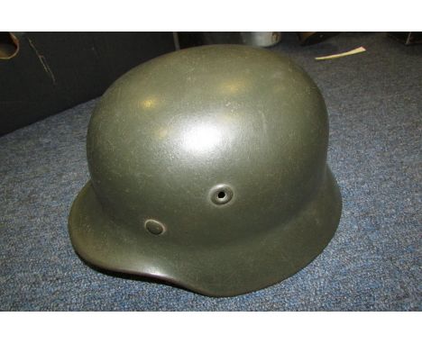 German Headwear - M40 single decal SS helmet. Decal 80% complete. No liner. Rear stamp to helmet DN 57. Inner helmet metal ba