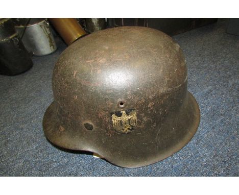 German Headwear - M42 Raw edge army helmet with rare single decal for such a late helmet. Rear stamp 3502. Decal 60% present.