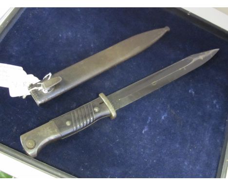 Bayonet: Nazi 3rd Reich Model 1884/98 knife bayonet in its steel scabbard. Scabbard marked 'bgm 40' (GENOSSENSCHAFTS-der-BUCH