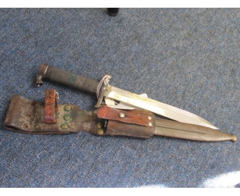 Bayonet: Swedish Model 1898 knife bayonet in its steel scabbard with original leather frog. Sound condition. 