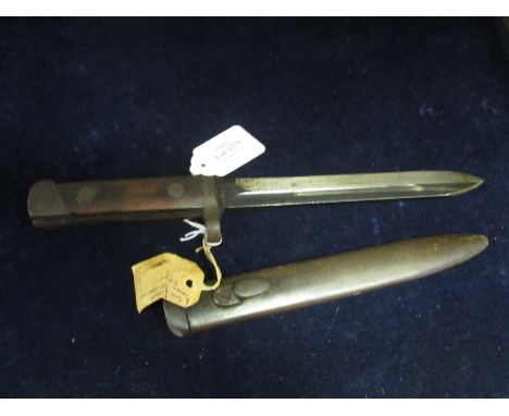 Bayonet: Italian Model 1938 Carcano knife bayonet in its steel scabbard. Sound condition overall. 