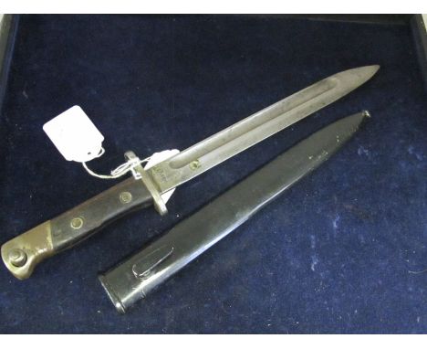 Bayonet: Siamese Mauser bayonet in its steel scabbard. Sound condition.