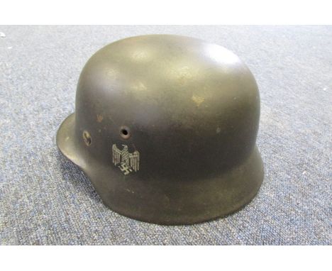 German Headwear - M40 army Stahlhelm with 90% original finish. However has single decal later applied. Temple stamp ET 66. Re