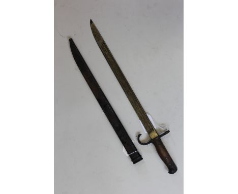 Bayonet: A Japanese Arisaka Model 1897 bayonet with hooked quillon. In its metal scabbard (dented). Black painted overall (pa