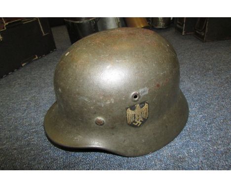 German Headwear - M 40 single decal German Stahlhelm (helmet) maker marked Q64 temple stamp, minor damage to Liner but comple