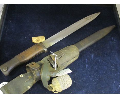 Bayonet: An Imperial German Model 1884/98 knife bayonet with wooden grips and flashguard made by F. HERDER A SN SOLINGEN in 1