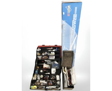 A boxed glider, further remote control model aircraft in the form of a fighter jet, tool box and an old ammo box containing r