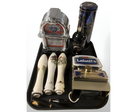 A group of breweryana including three ceramic bar optic hand pulls decorated with hunting scenes, Labatt's Canadian lager bar
