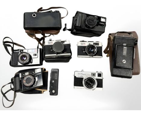 A quantity of pocket 35 mm cameras including Minolta 24 Rapid, two Ricoh 500 ME cameras, Canon AF35M, Canon Mega Zoom 76, Can