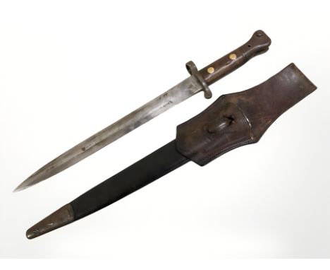 A British 1888 pattern Lee Metford bayonet by Wilkinson London, length 30.5 cm, in leather mounted sheath with frog