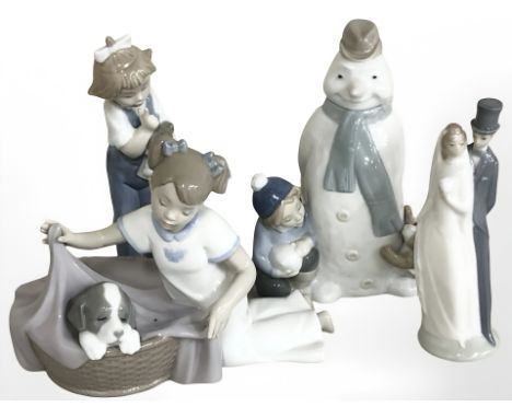 Four various Nao figures and groups including Bride and Groom, snow man etc, tallest 19 cm