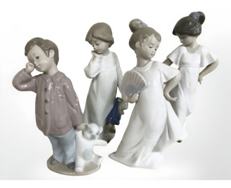 A group of four Nao figures, boys and girls, tallest 22 cm
