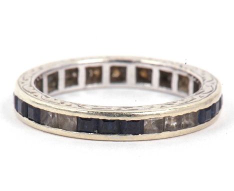 A 9ct white gold blue and white stone full eternity ring, size M