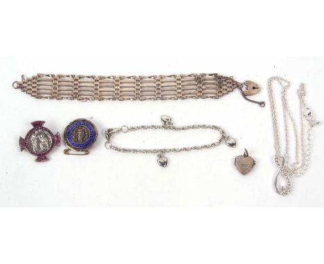 Mixed lot to include a silver gate bracelet, two hallmarked silver and enamel brooches, a small white metal heart pendant tog