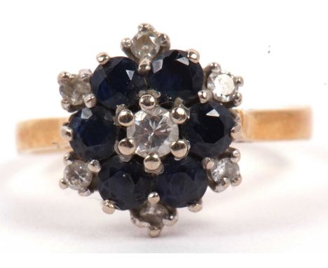 Sapphire and diamond cluster ring, a flower head design, stamped 18, size L