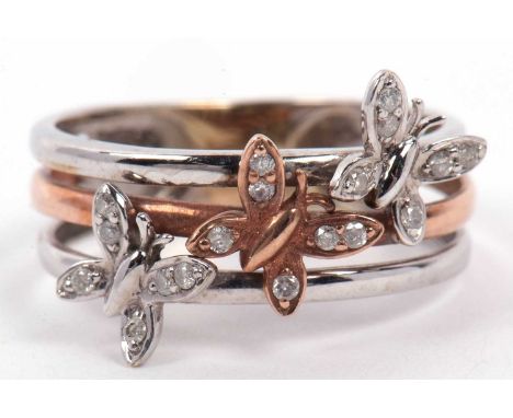 A modern triple two-tone colour band ring, each band applied with a butterfly with small diamond set wings, total ct diamond 