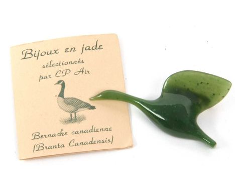 A vintage carved green jade bird in flight dimentional lapel pin brooch